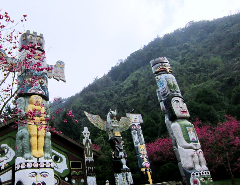 Tall Carved Totem Poles