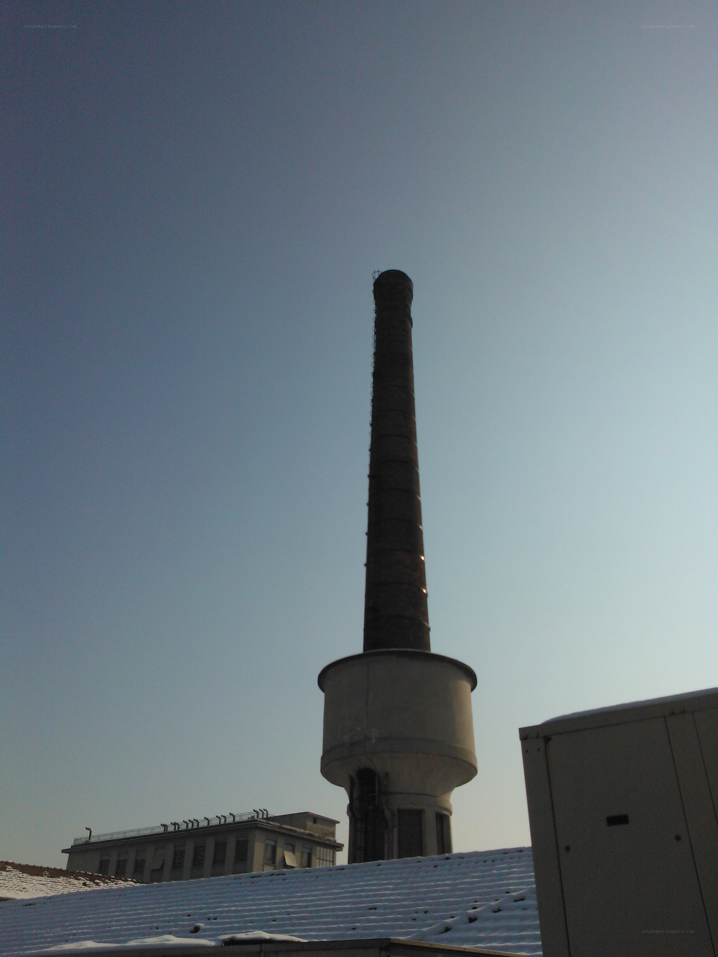 tall chimney against blue sky