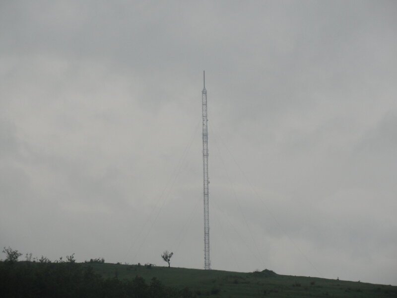 tall communication tower on hill