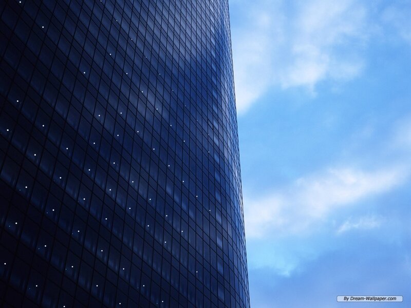 tall glass building against blue sky
