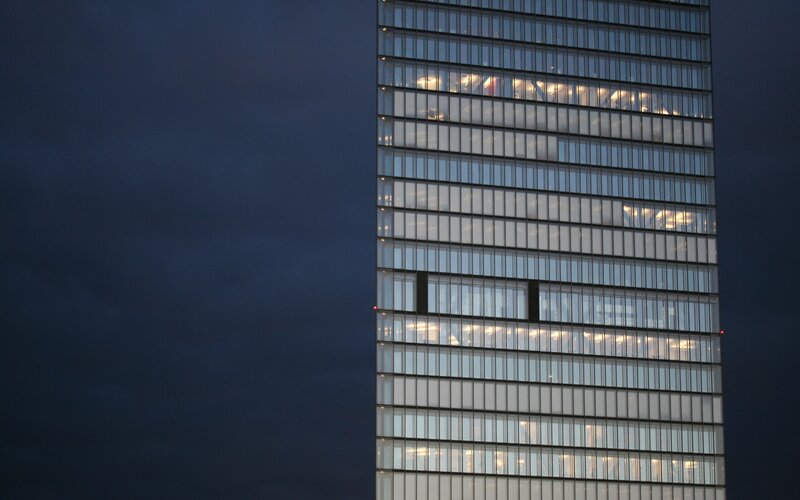 tall glass building at dusk