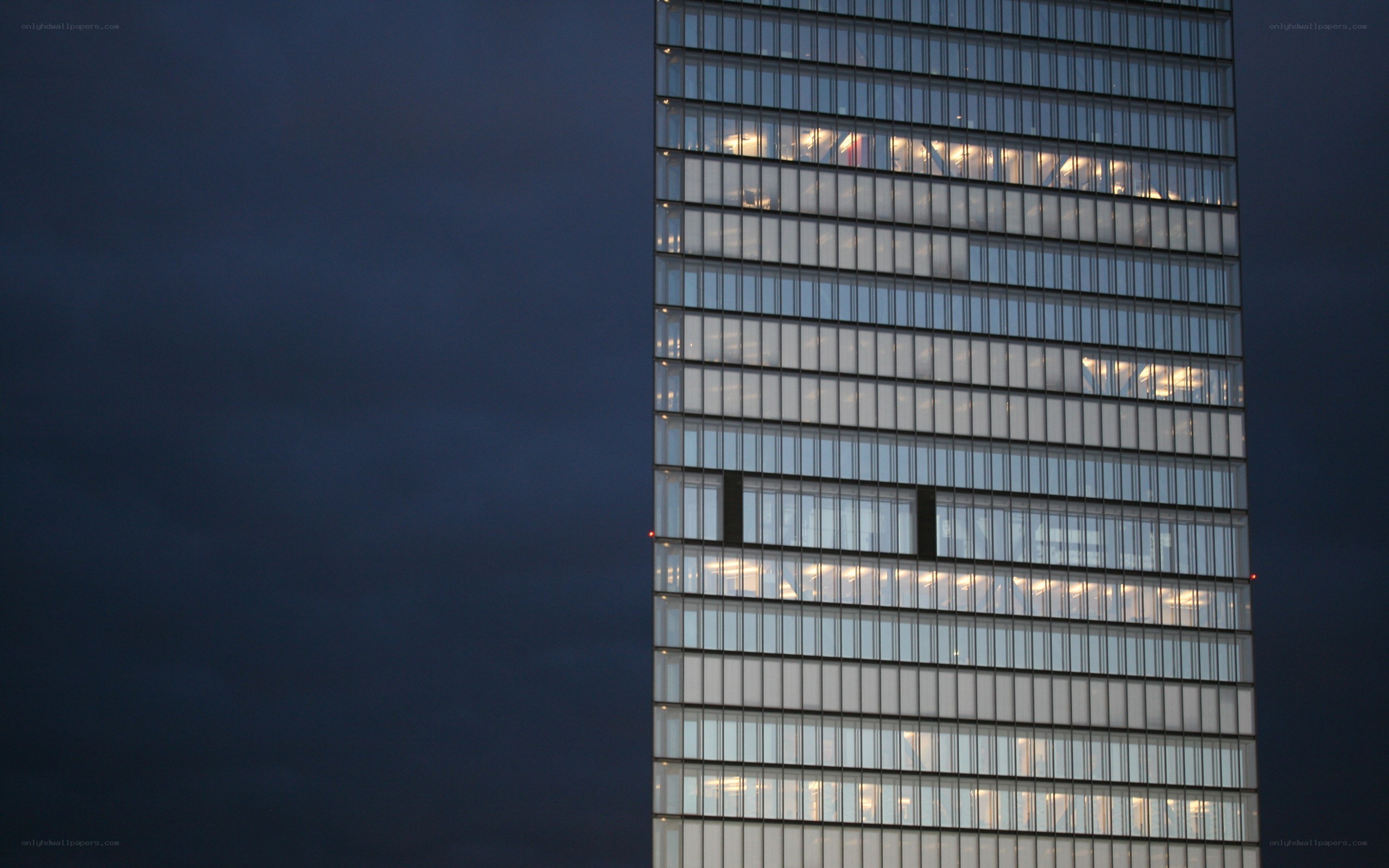 tall glass building at dusk