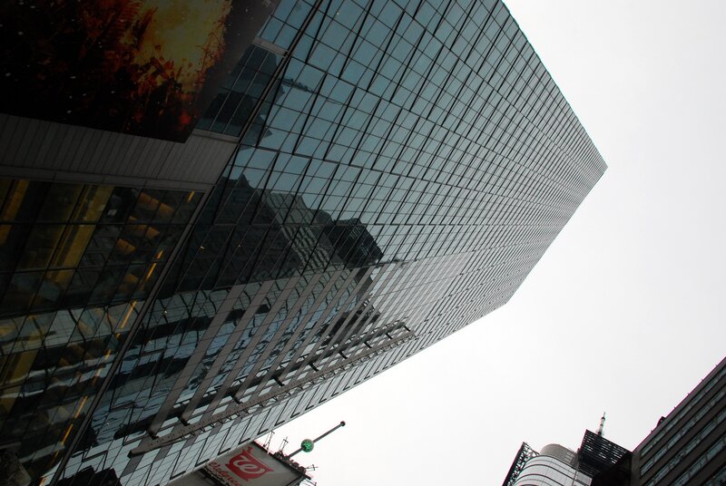 tall glass building in city