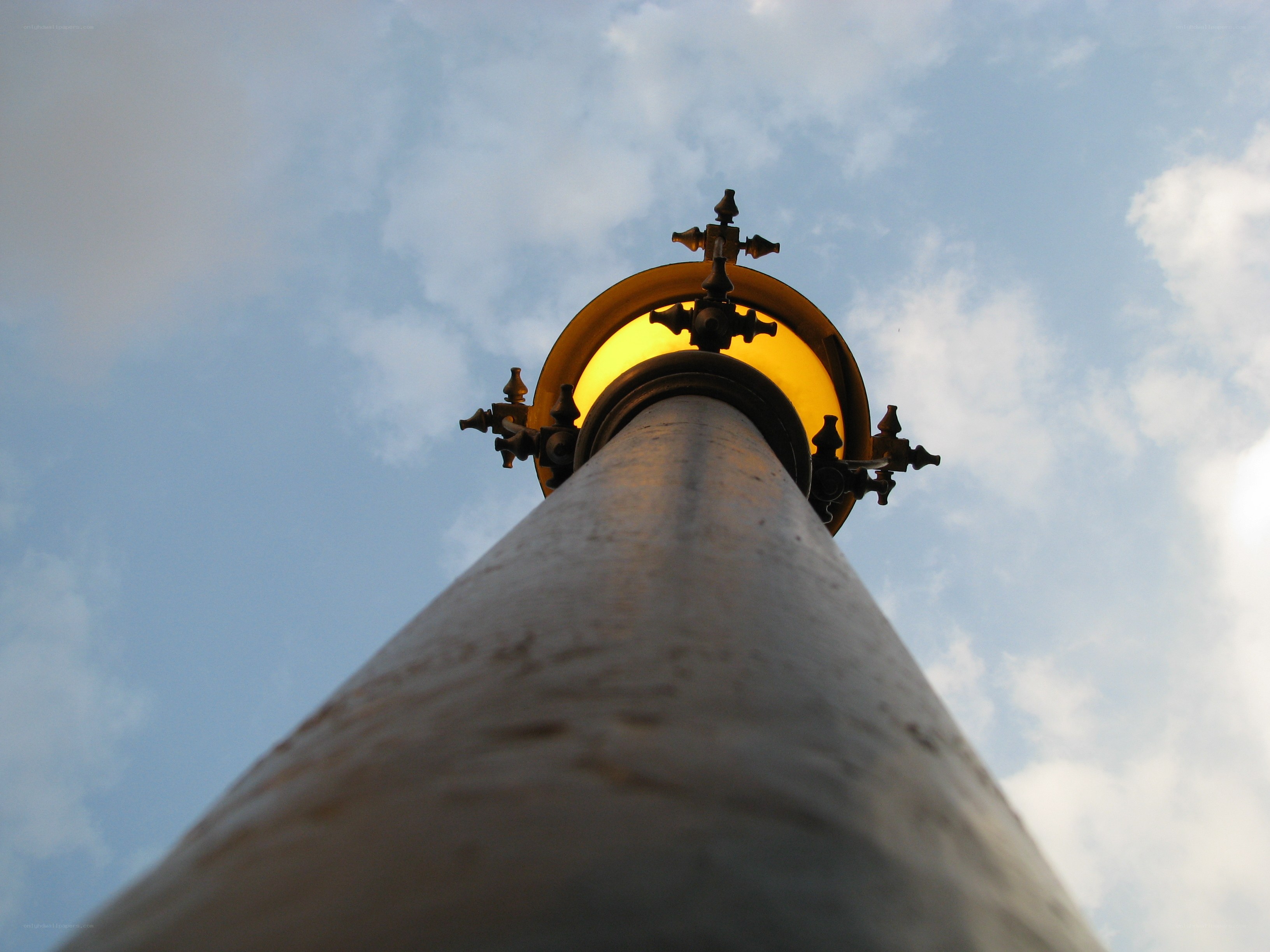 tall lamp post against sky