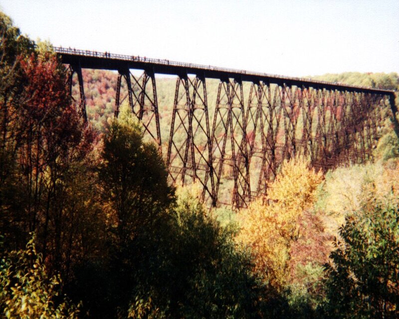 tall metal bridge in autumn