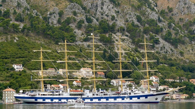 tall ship in coastal harbor
