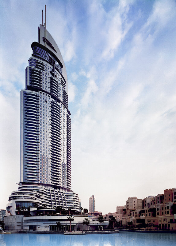 tall skyscraper by water