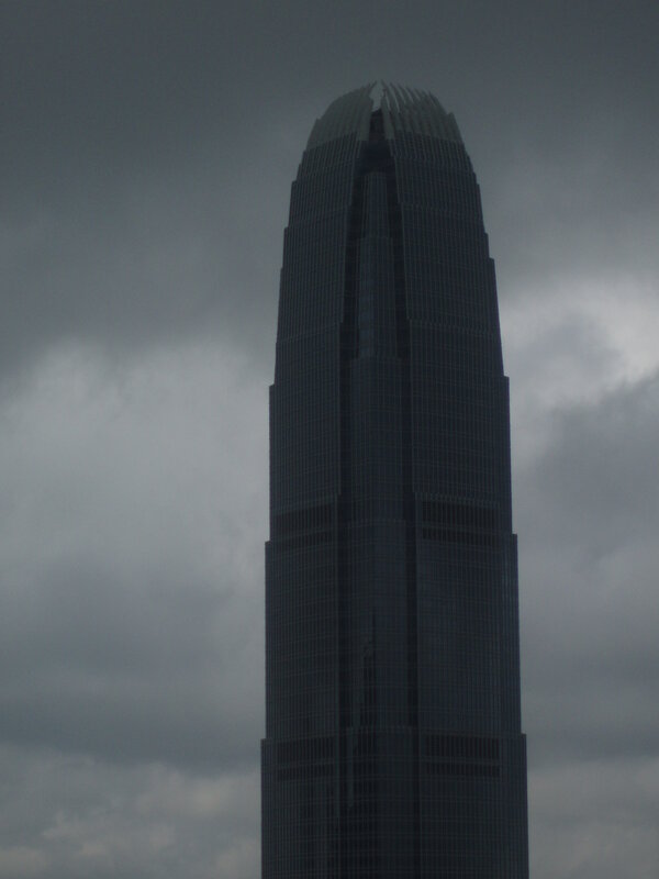 tall skyscraper under cloudy sky