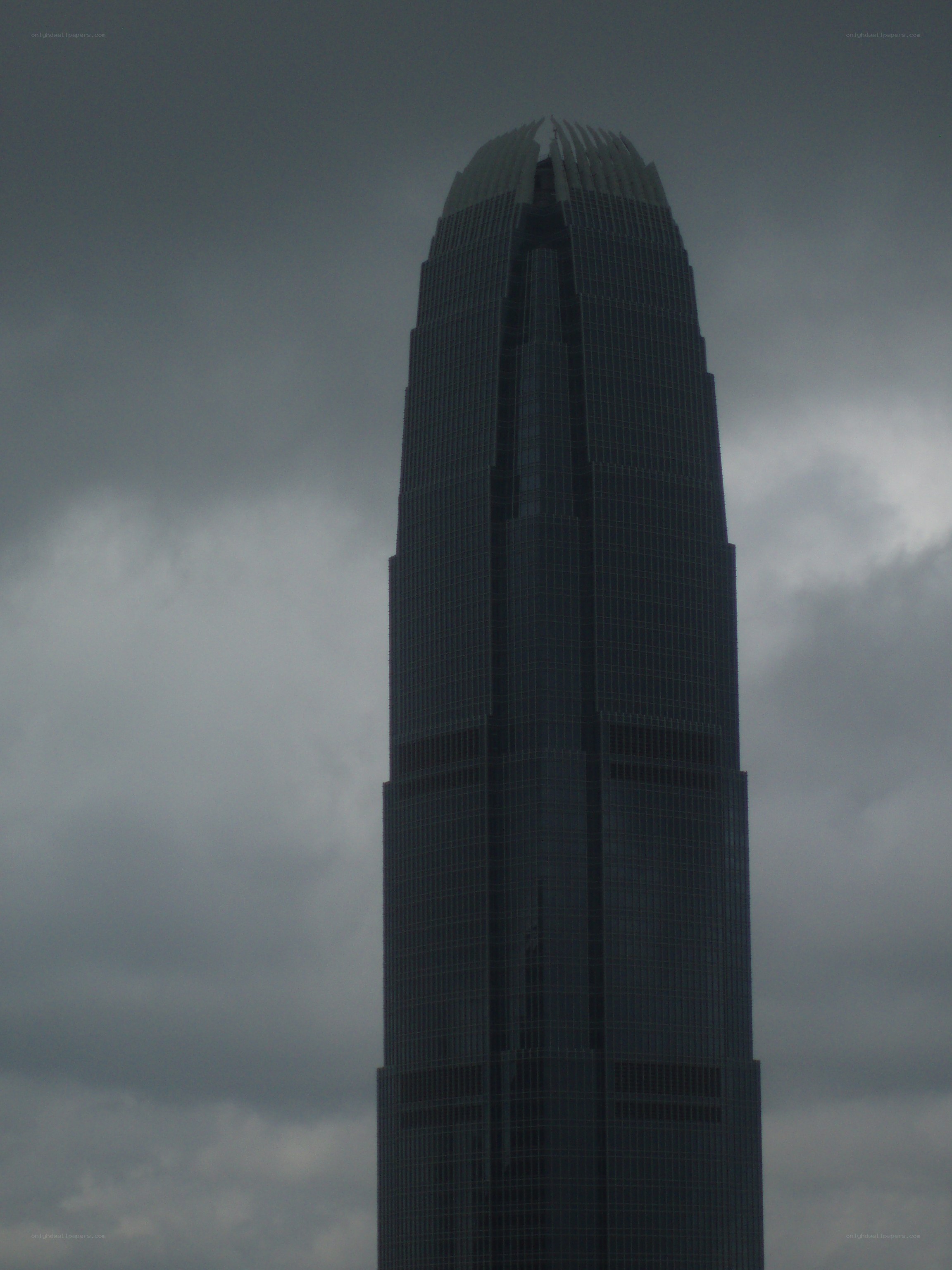 tall skyscraper under cloudy sky