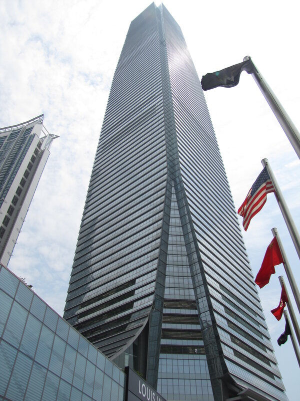 tall skyscraper with flags