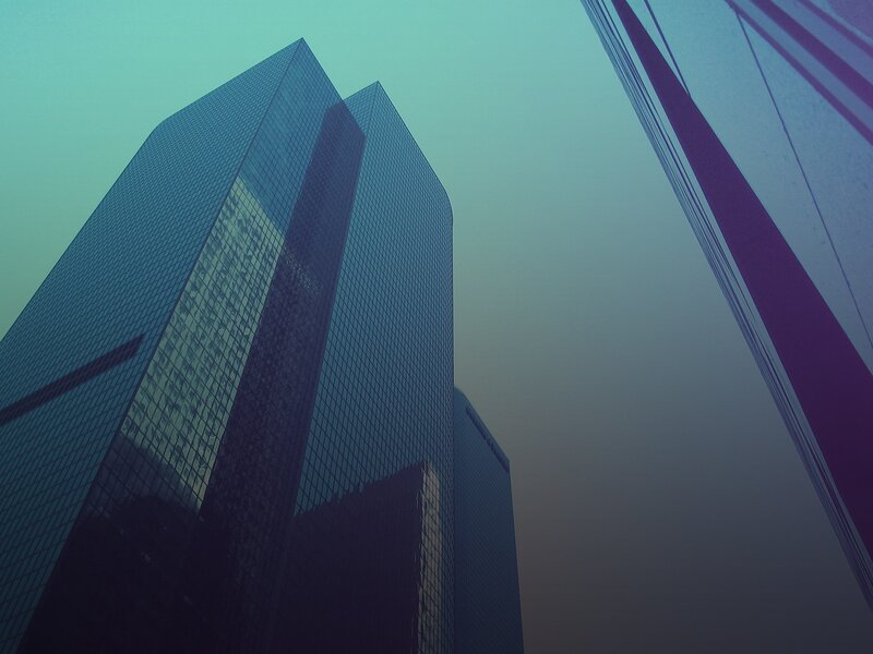 tall skyscrapers in fog