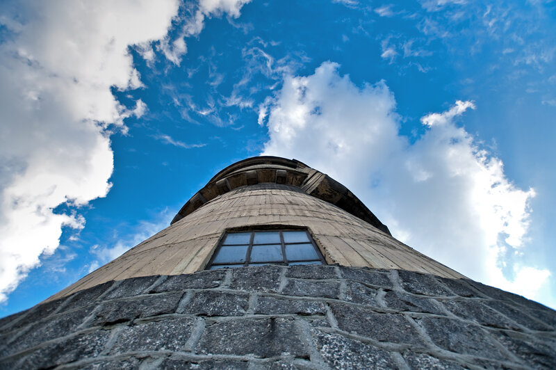 tall stone tower against blue sky