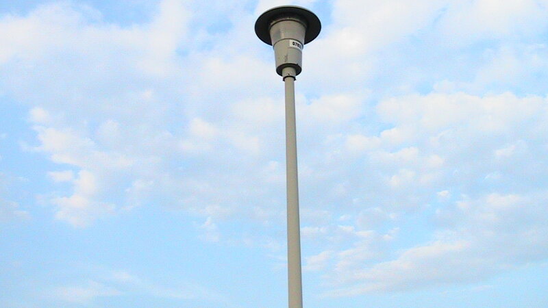 tall street lamp against sky