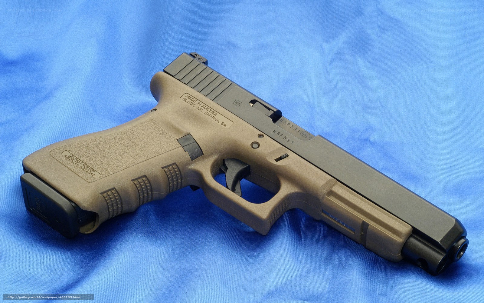 tan and black handgun