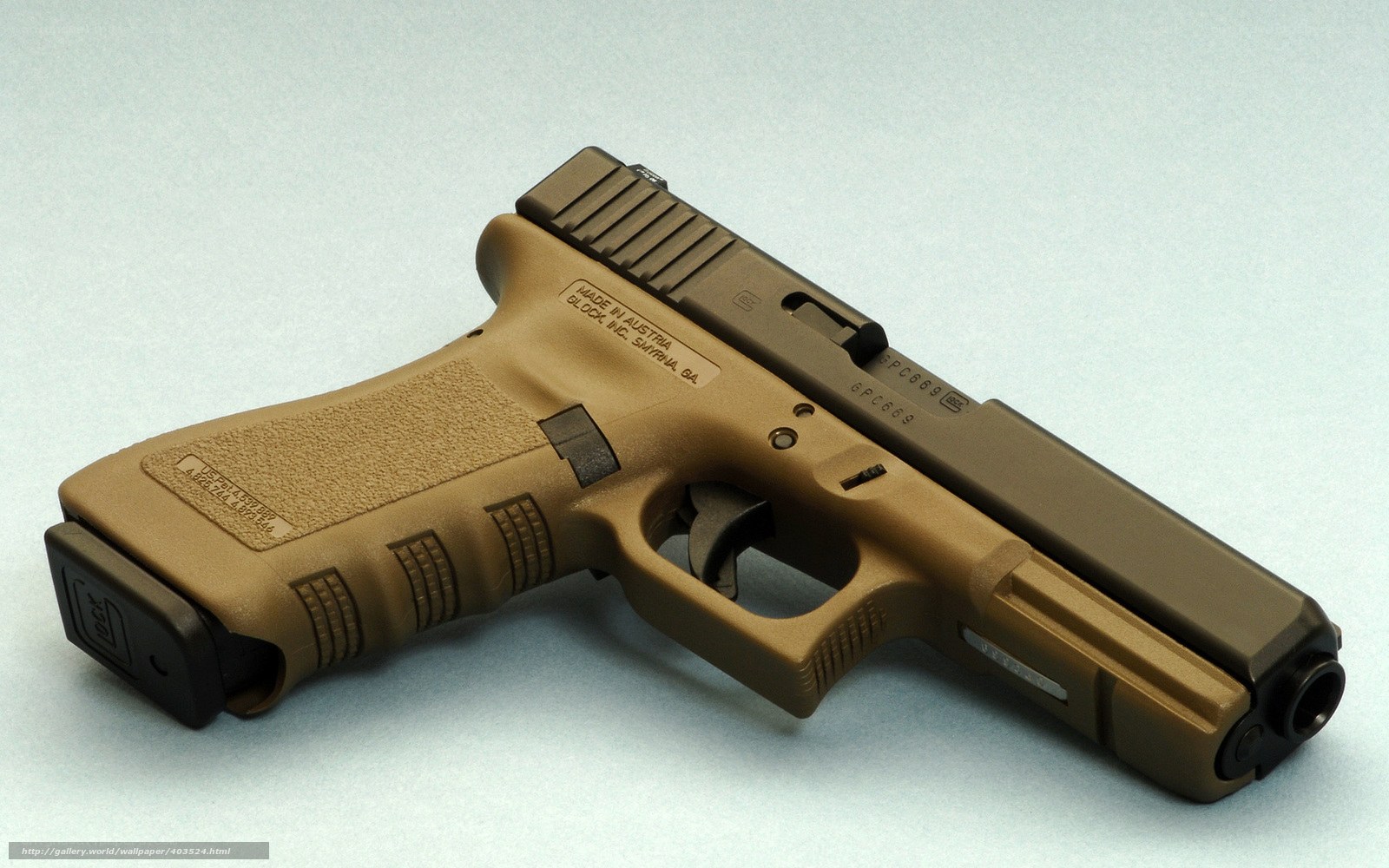 tan-colored handgun