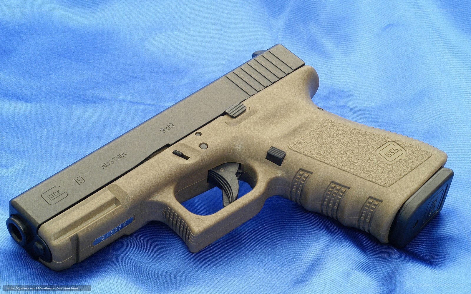 tan Glock 19 pistol