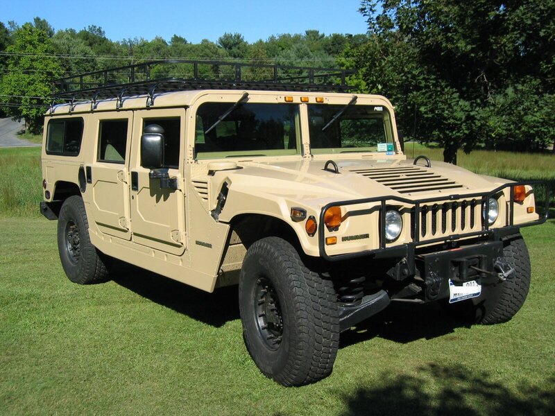 Tan Humvee on grass
