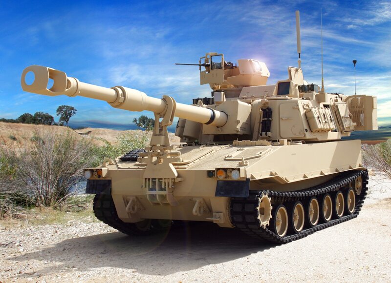 Tan military tank in desert