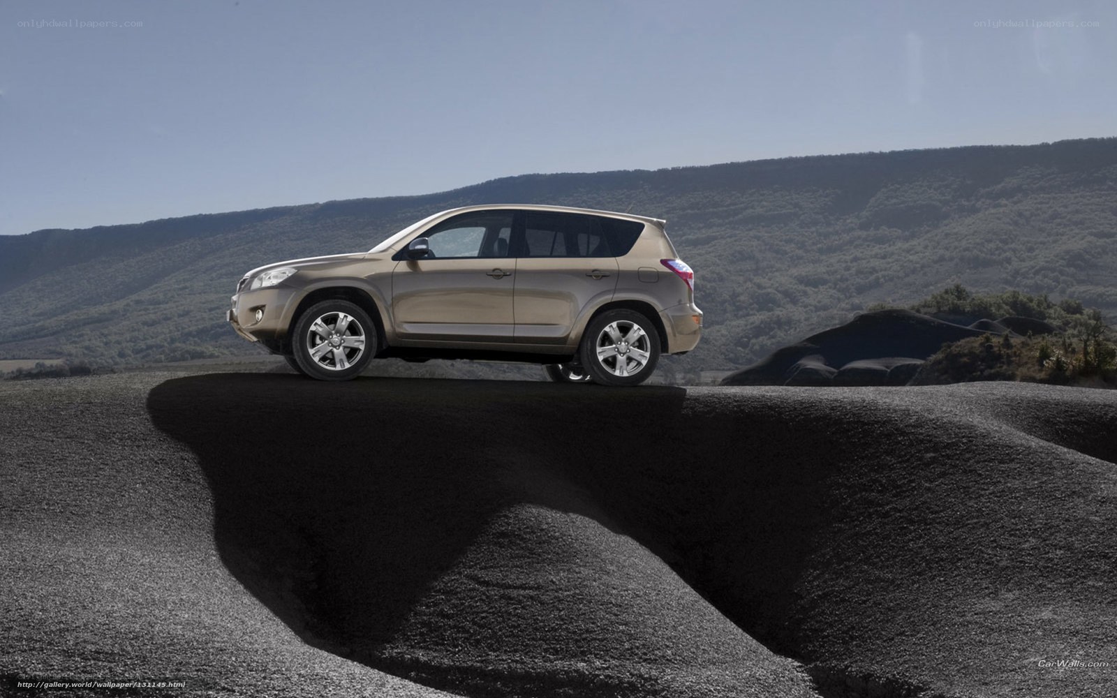 Tan SUV on rocky terrain