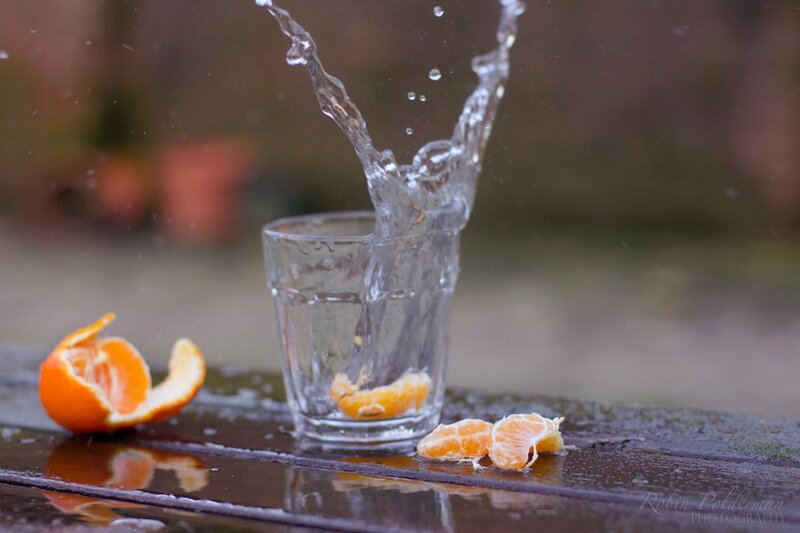 Tangerine Splashing in Glass