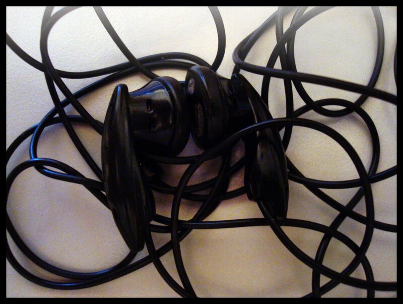 tangled black earbuds
