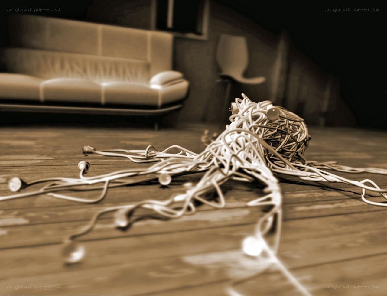 Tangled cables on wooden floor