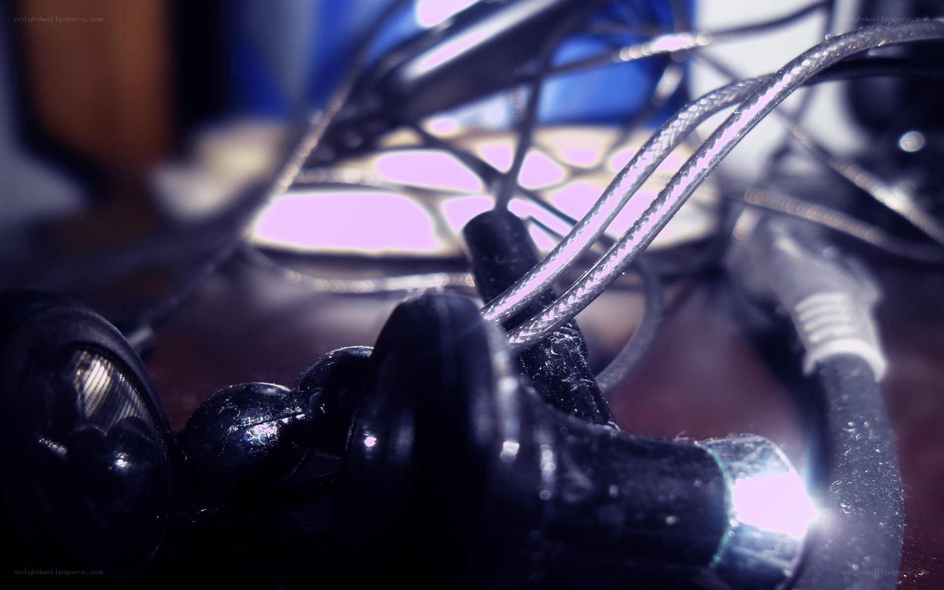 tangled earbuds and cables