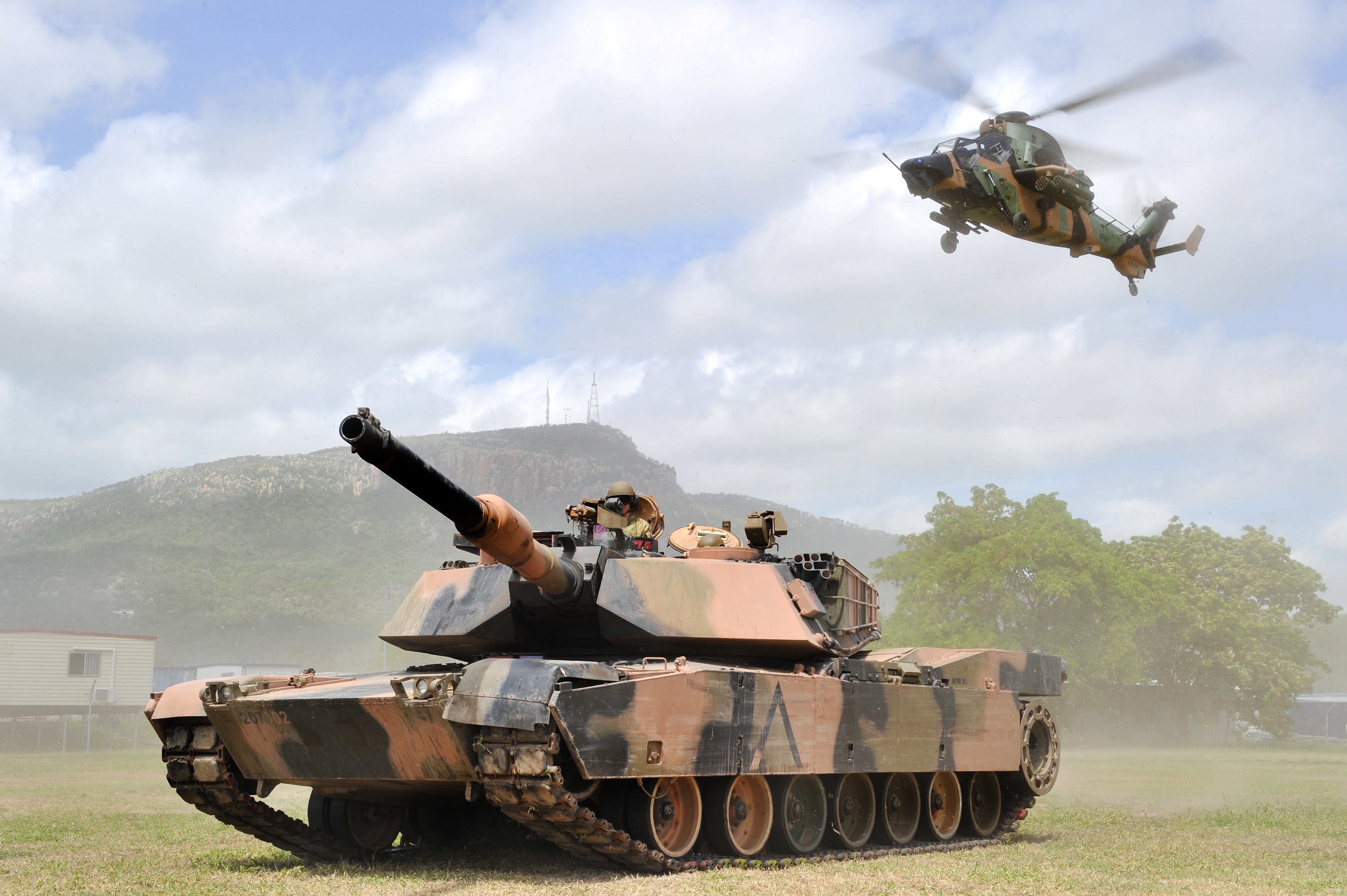 Tank and helicopter in action