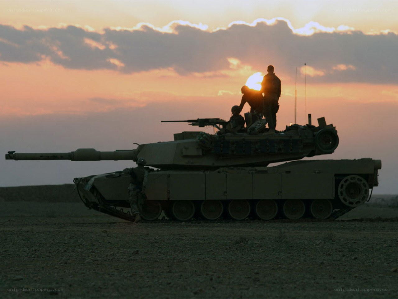 Tank at sunset with soldiers