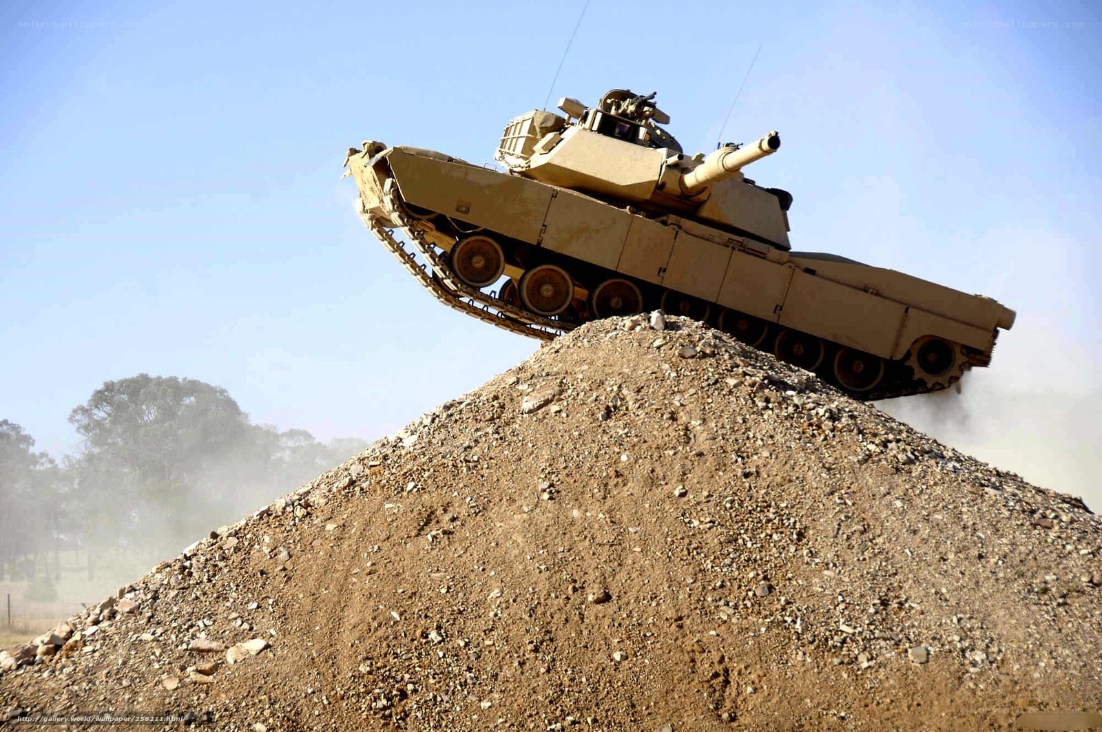 Tank climbing a dirt mound