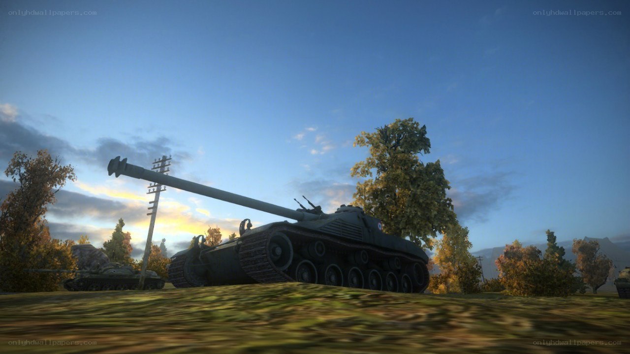 Tank in a field at sunset