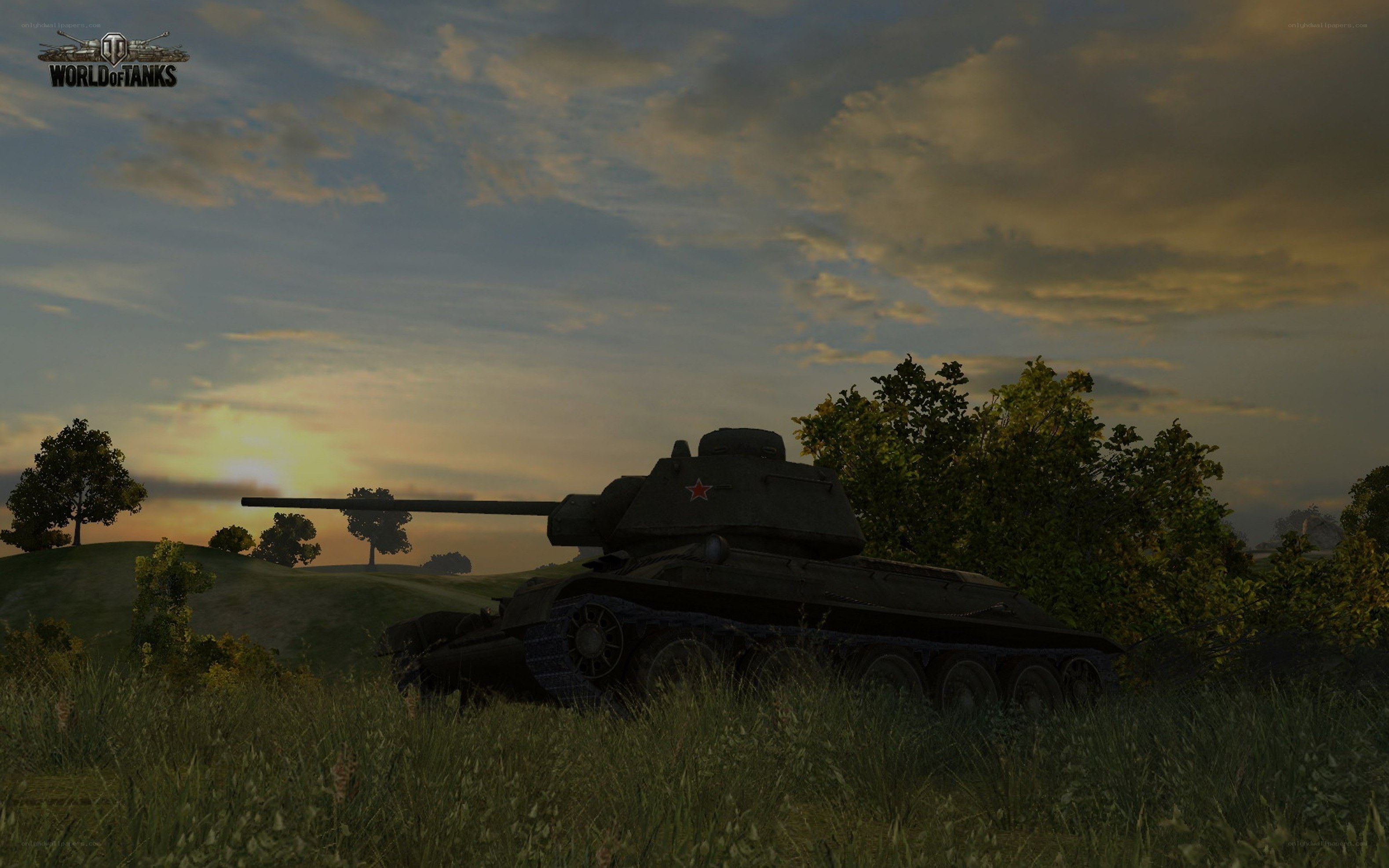 Tank in a field at sunset