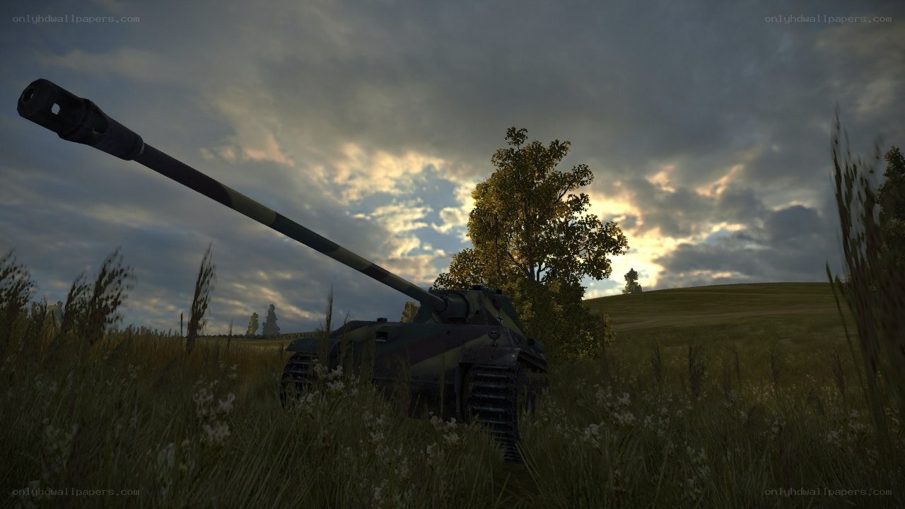 Tank in a field at sunset