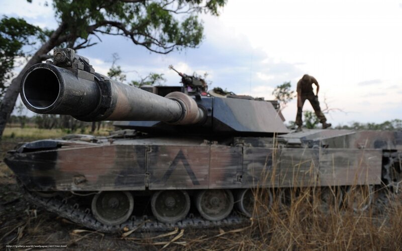 Tank in a field with soldier