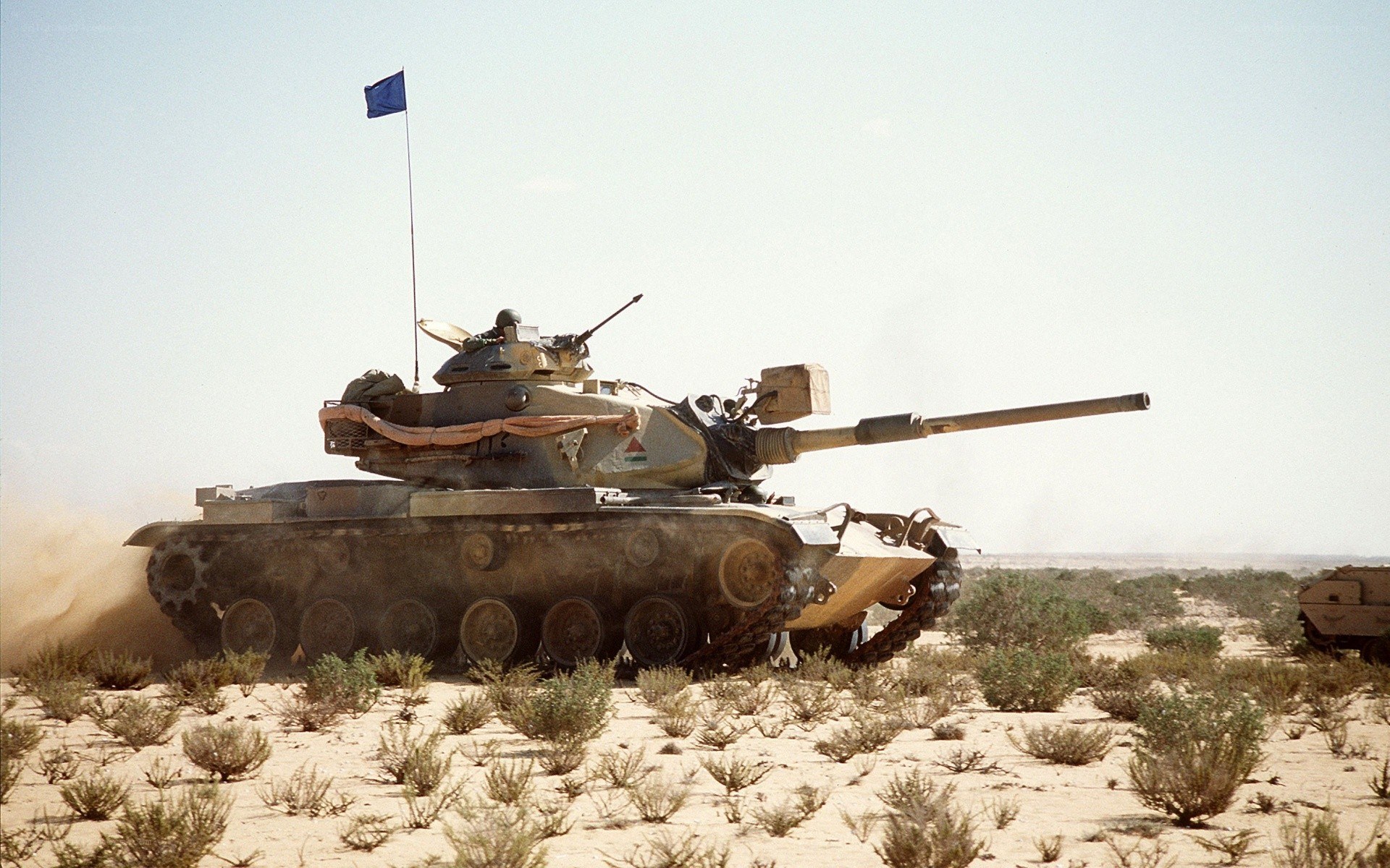 Tank in desert terrain