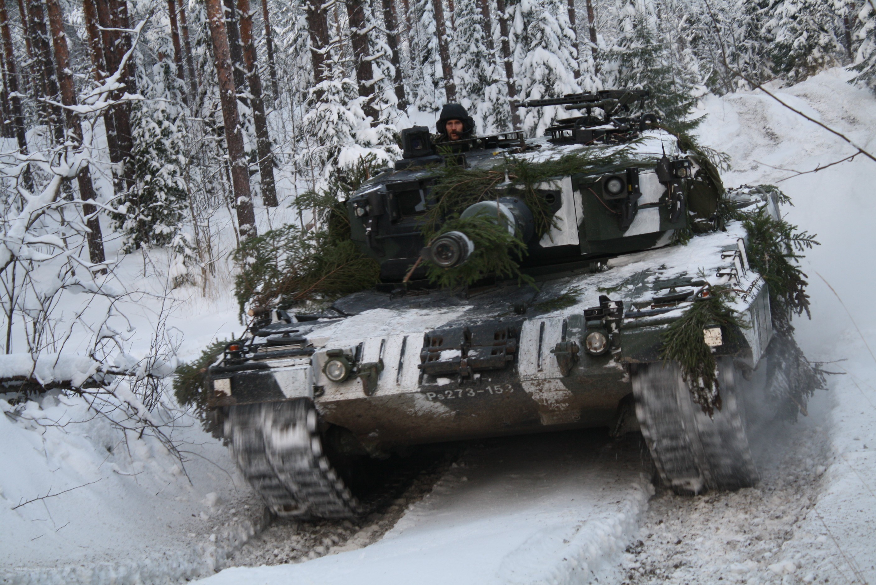 Tank in snowy forest