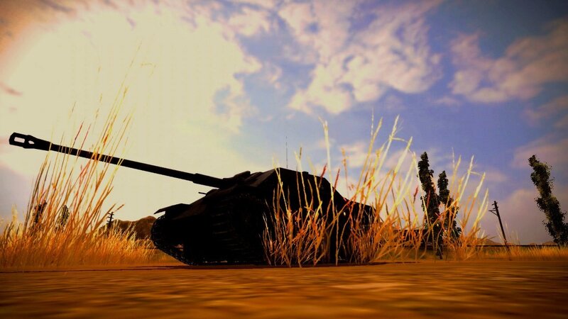 Tank in tall grass at sunset