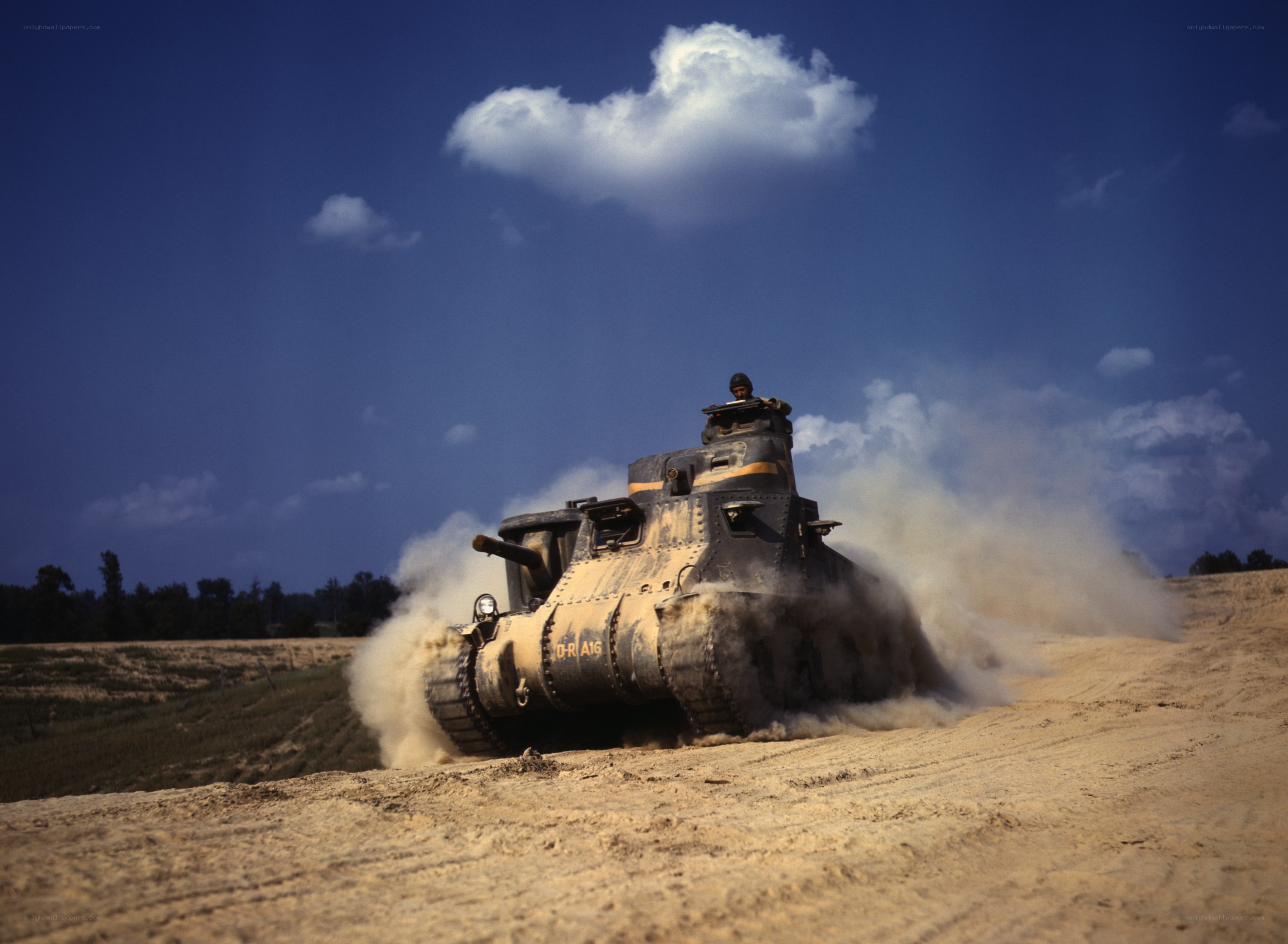 Tank moving on dirt field