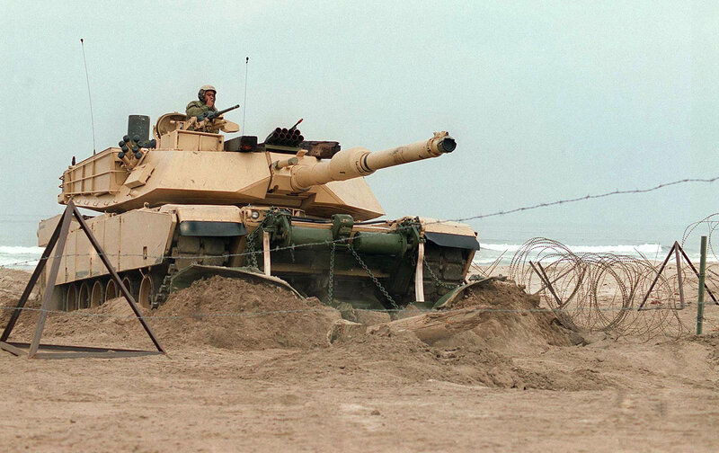 Tank on a beach with soldier