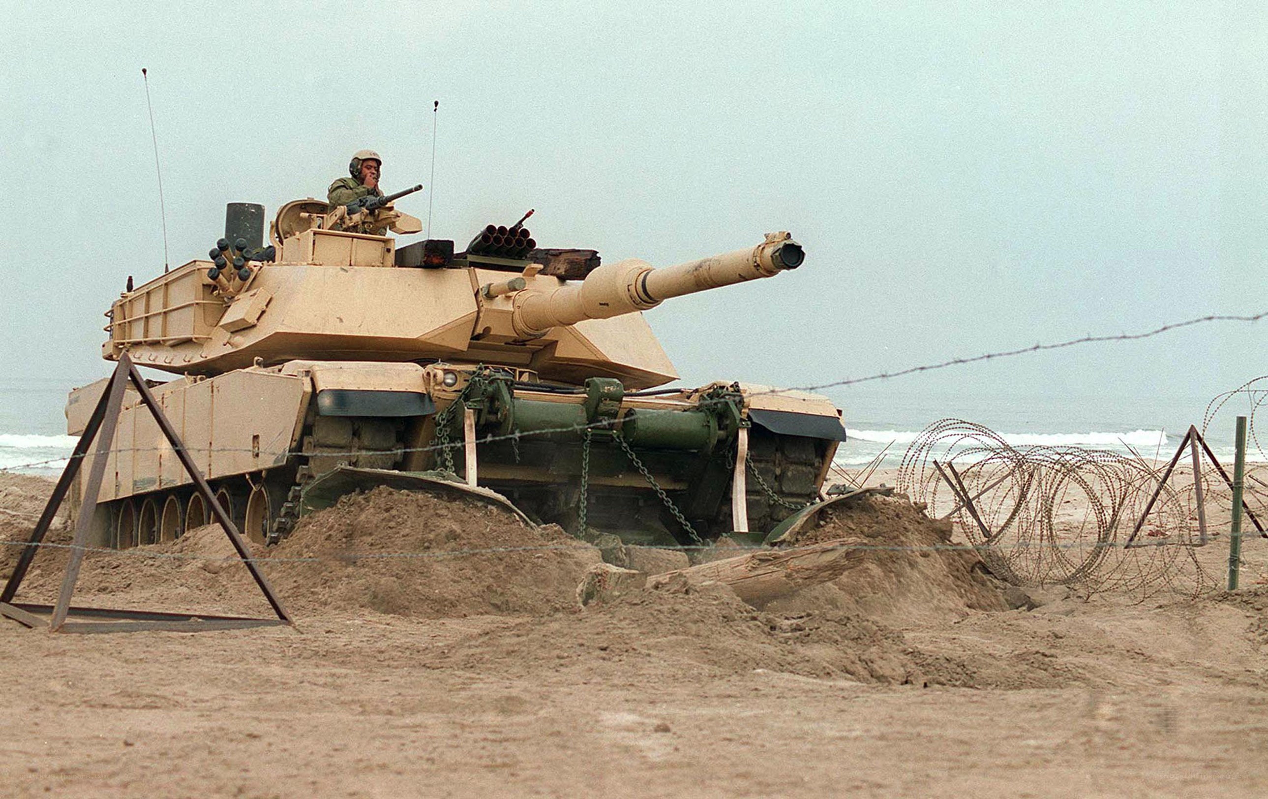 Tank on a beach with soldier