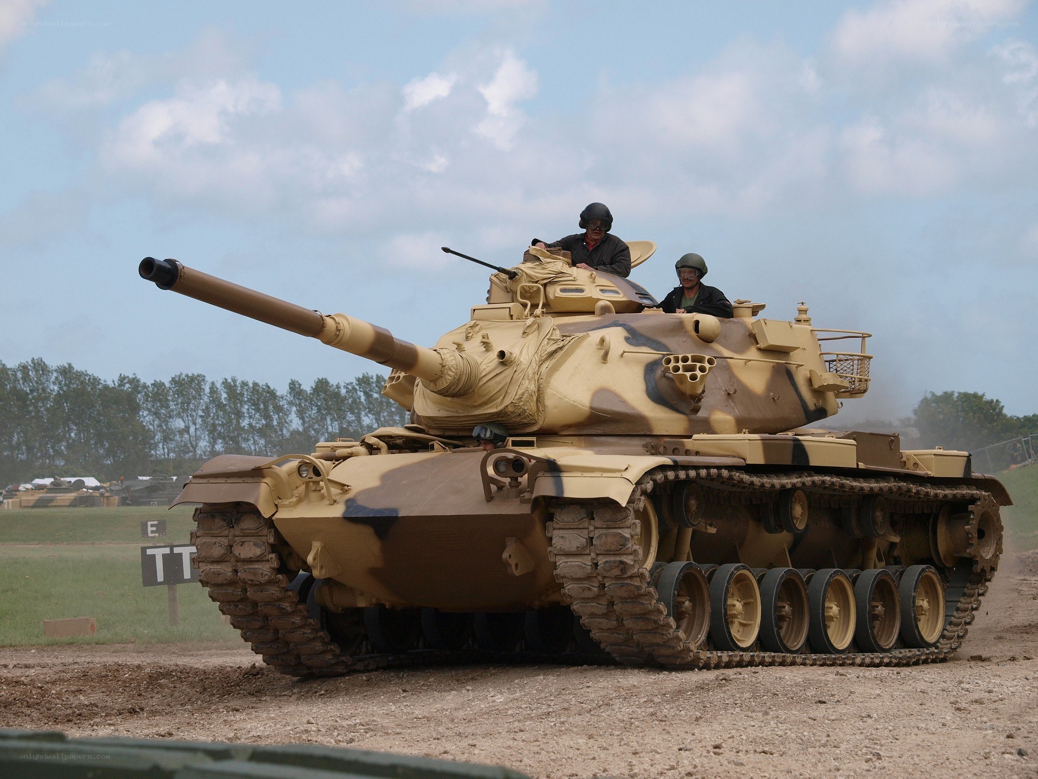 Tank on a dirt field