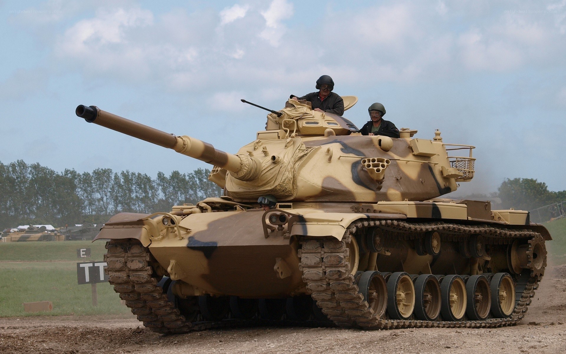 Tank on a dirt field
