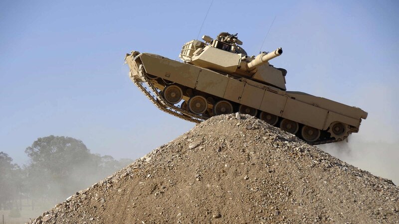 Tank on a Dirt Mound — Brown, Dramatic, Afternoon