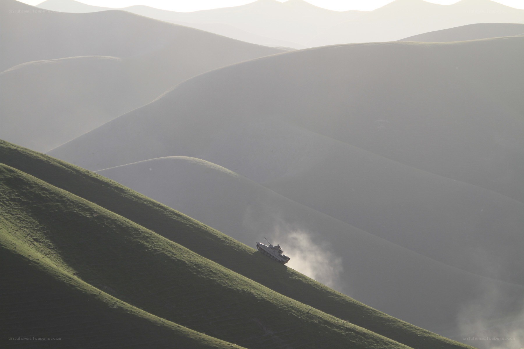Tank on a green hillside