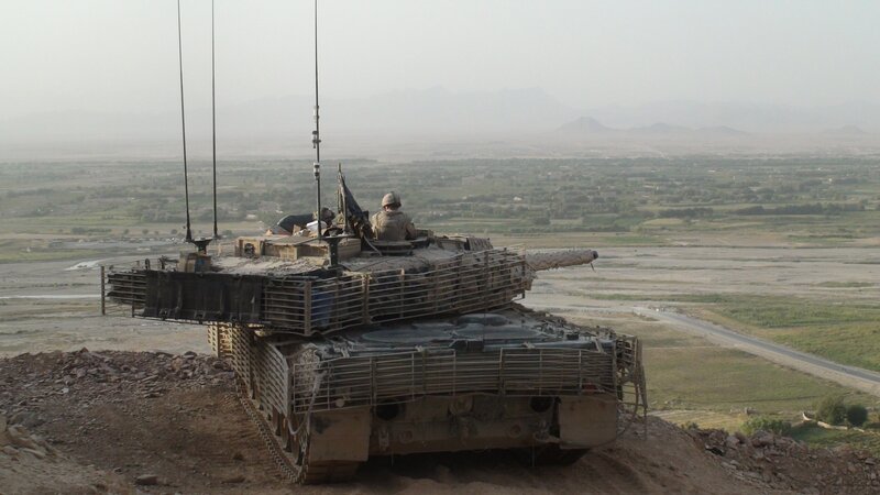Tank on a hilltop overlooking a valley