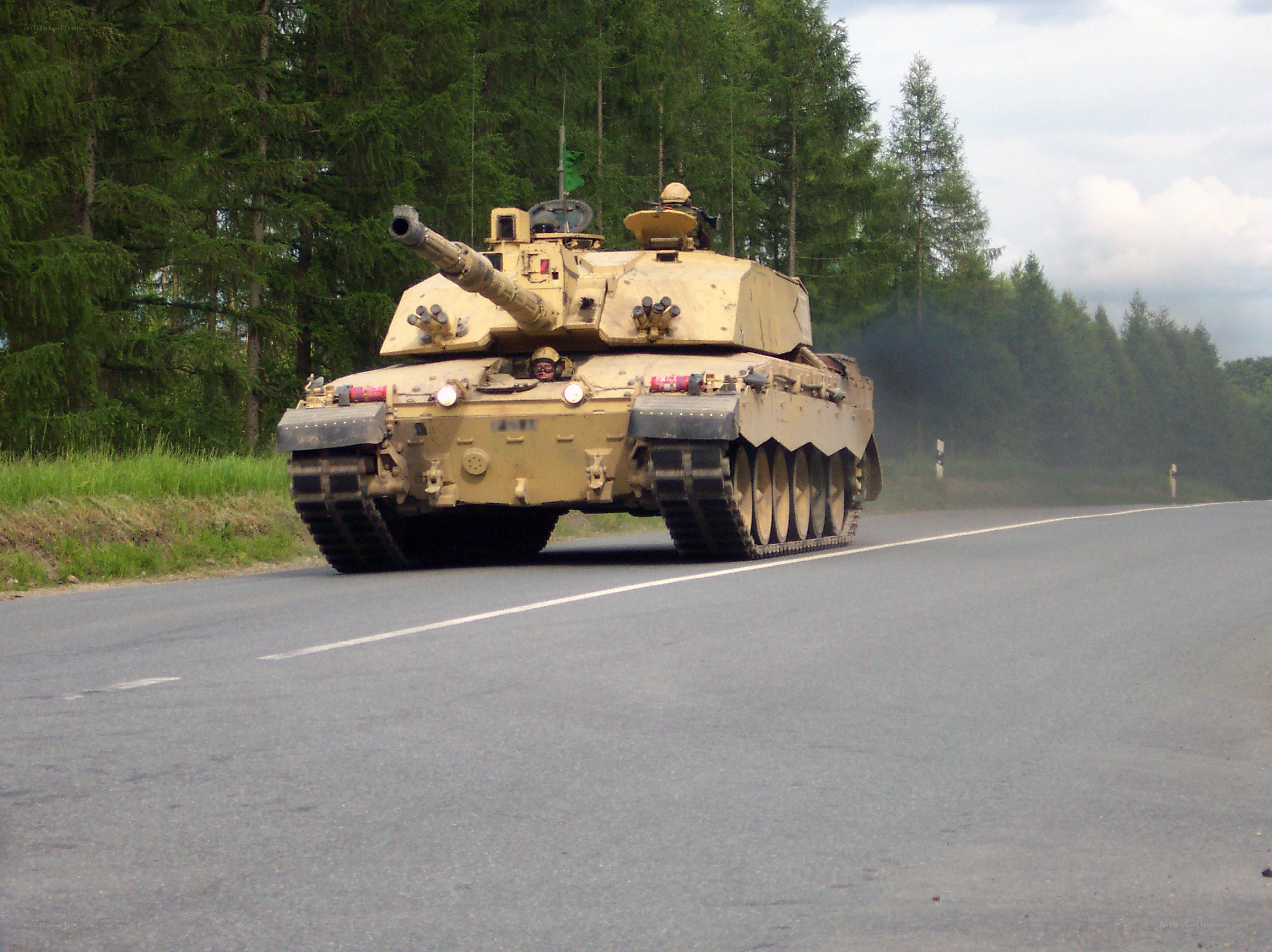 Tank on a road in forest