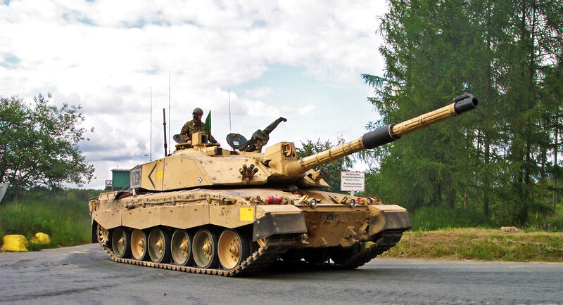 Tank on a road with soldier