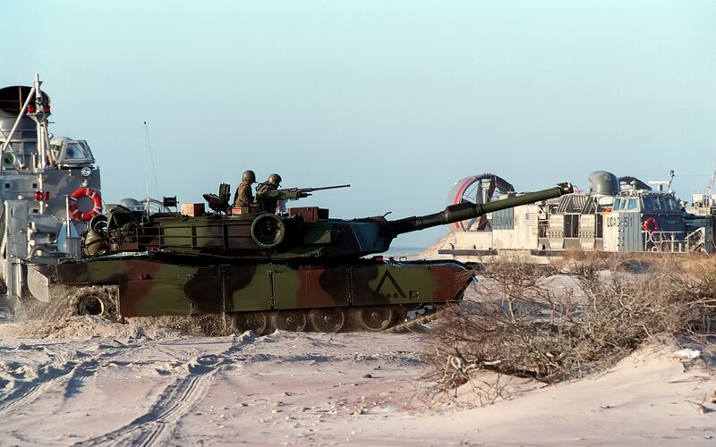 Tank on beach during military exercise