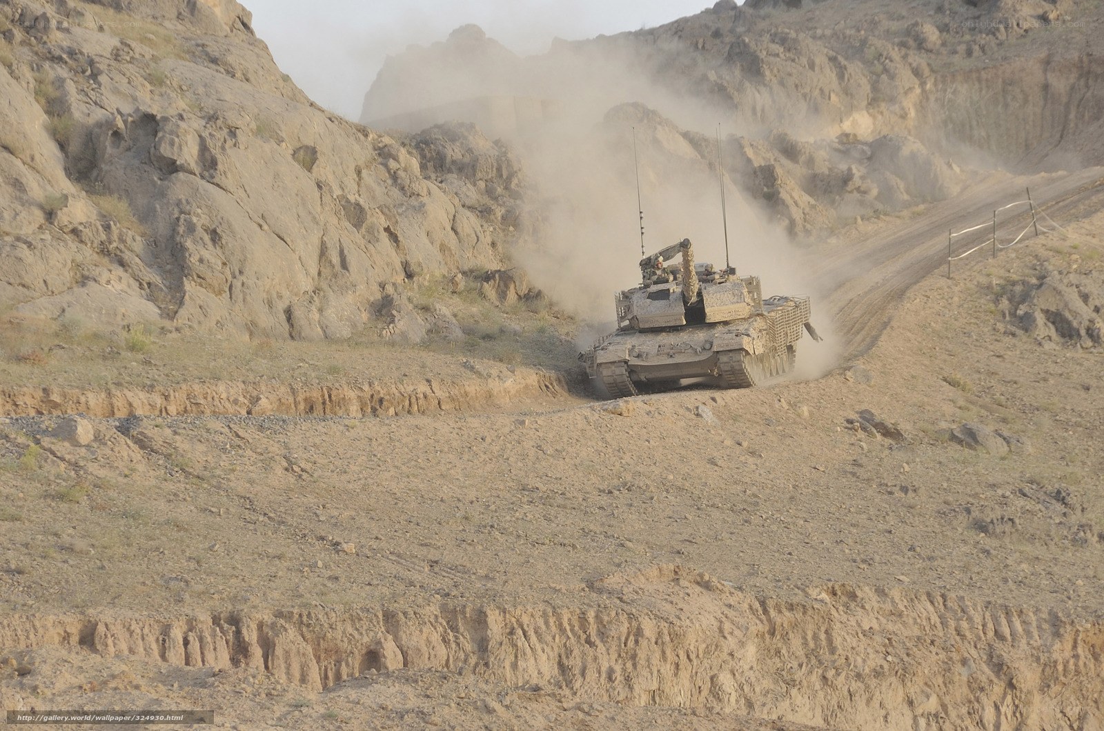 Tank on dusty mountain road