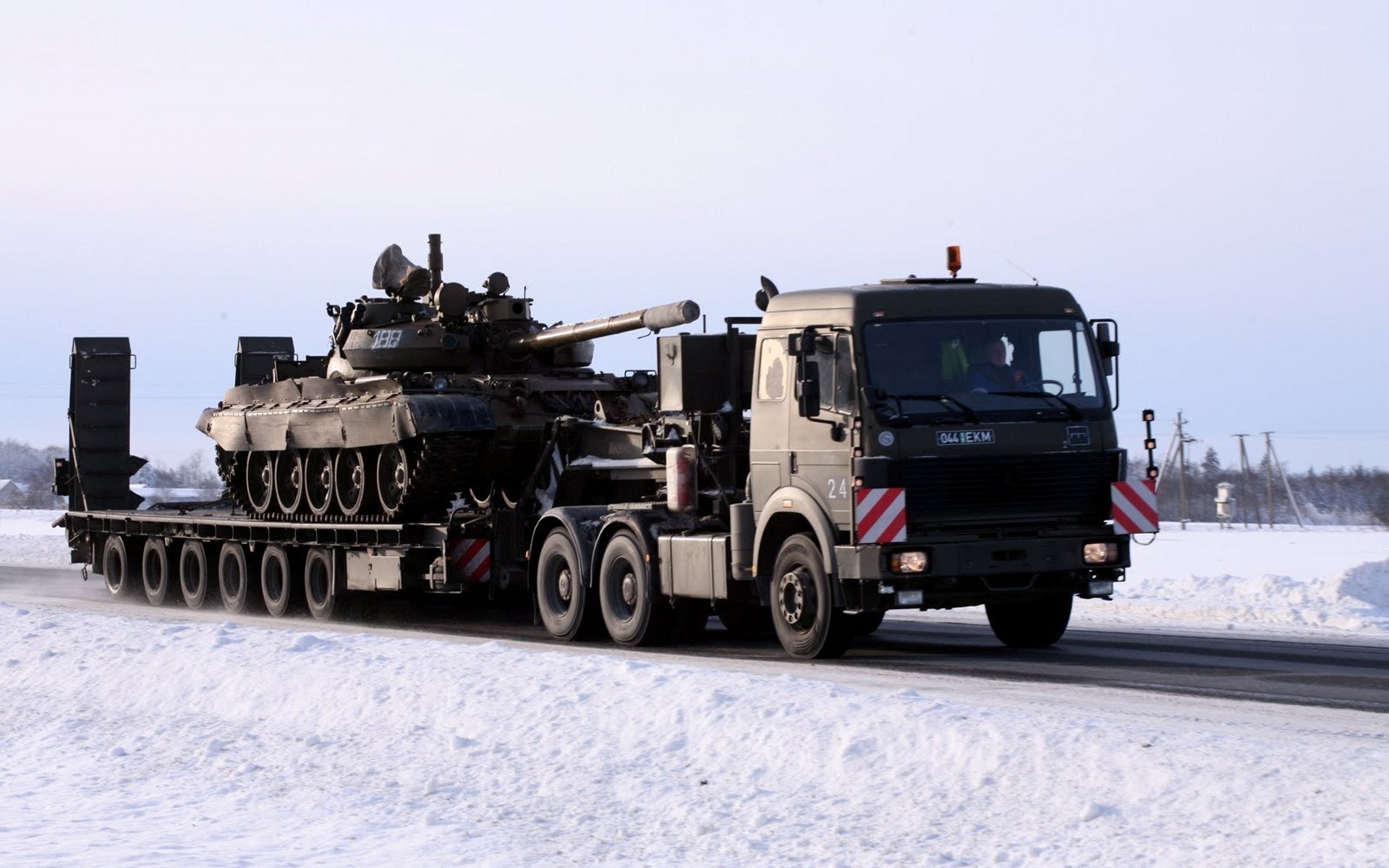 Tank transport on snowy road